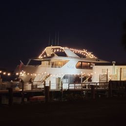 a boat docked at night a boat docked at night
