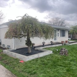 Enhanced Landscaping - Newly built Glenn stone retaining wall with fabric during the project . Not final product .
