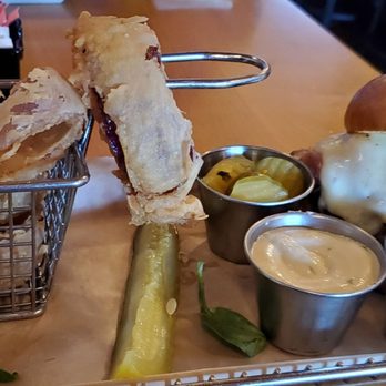 Hops Burger Bar - Cuban cow burger with onion rings - Burgers Near Me - Greensboro, North Carolina Hops Burger Bar - Cuban cow burger with onion rings - Burgers Near Me - Greensboro, North Carolina