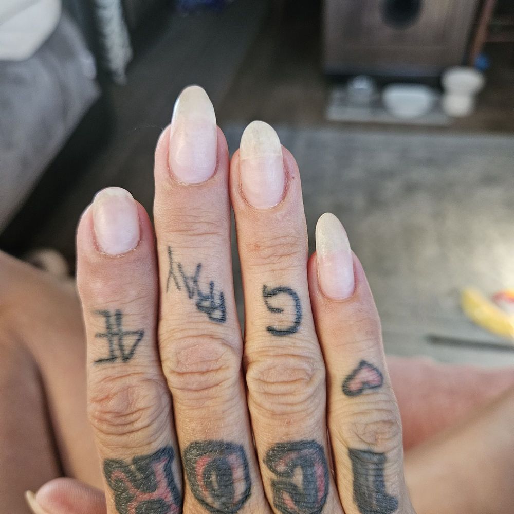 they weren't crooked when I went in. my ring finger needed repaired. it was coffin shaped, because I wanted that way and told him that.