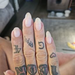 they weren't crooked when I went in. my ring finger needed repaired. it was coffin shaped, because I wanted that way and told him that. they weren't crooked when I went in. my ring finger needed repaired. it was coffin shaped, because I wanted that way and told him that.