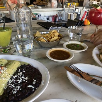 Cha Cha's Latin Kitchen - Complimentary chips and salsas. Crab & shrimp enchilada in the bottom left. - Mexican Near Me - Irvine, California Cha Cha's Latin Kitchen - Complimentary chips and salsas. Crab & shrimp enchilada in the bottom left. - Mexican Near Me - Irvine, California