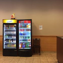 Mei Wei East - Some of the chairs available for patrons, and drink area. Stocked with Snapple products, Coca-Cola products, Chinese sweet tea. (11/12/2017)