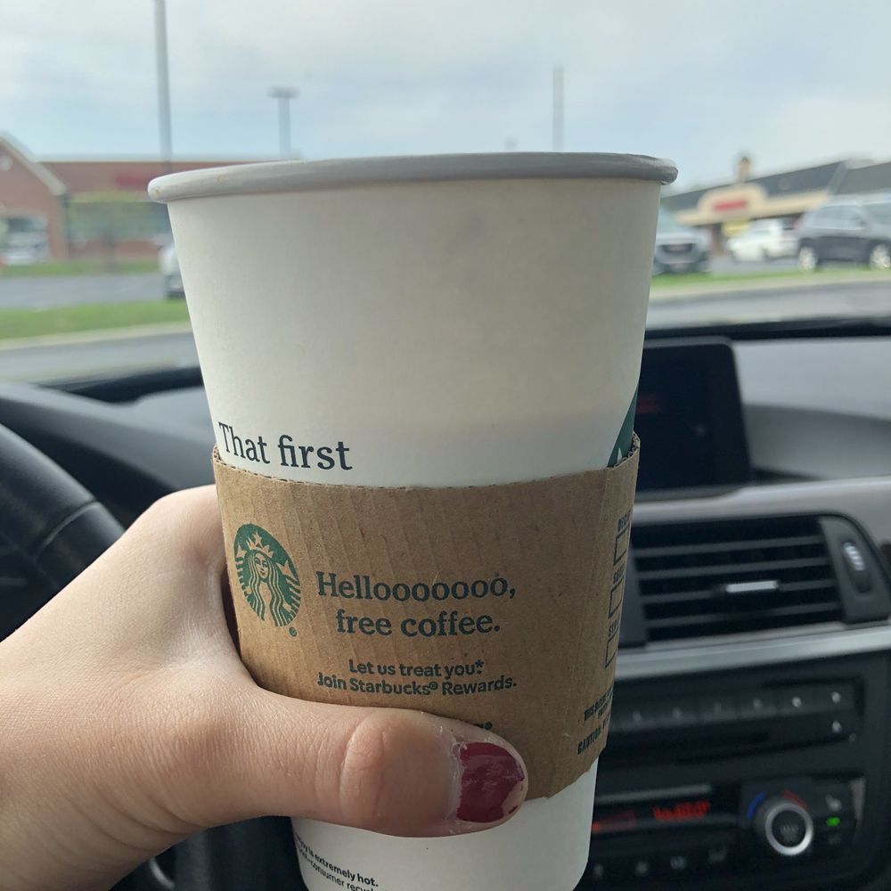 Starbucks - a hand holding a cup of coffee - Coffee & Tea Near Me - Medina, Ohio Starbucks - a hand holding a cup of coffee - Coffee & Tea Near Me - Medina, Ohio