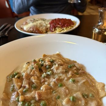 Portabellos - Entrees of chicken parmigiana in the back and portobello ravioli in forefront. - Italian Near Me - Kennett Square, Pennsylvania