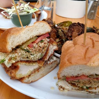 Down On Grayson - Fried chicken sandwich with side of Brussels sprouts - New American Near Me - San Antonio, Texas