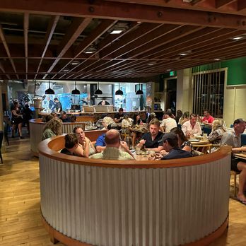 Monkeypod Kitchen by Merriman - One booth in the dining room - New American Near Me - Kihei, Hawaii Monkeypod Kitchen by Merriman - One booth in the dining room - New American Near Me - Kihei, Hawaii