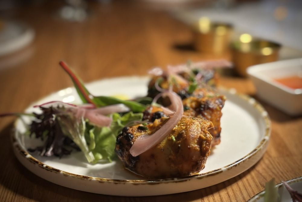 The Essence Redefining Indian Food Logo