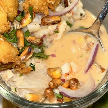 Lima Limon - a bowl of food with a spoon in it - Peruvian Near Me - Las Vegas, Nevada