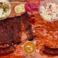 Smokesmith Bar-B-Que - Two sausages that we ate half of - they are enormous!  The ribs, ouf ouf. Perfectly smoked and tender.
