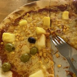 The New Haven - Order any pizza and then modify it anywhere you like. They will take care of you.  Like my olives instead of ham.