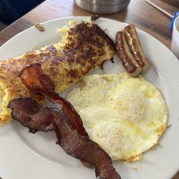 Hash browns eggs over medium, sausage and bacon Hash browns eggs over medium, sausage and bacon