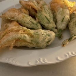 Divine, simply divine SQUASH  blossoms deep fried, the flavor insane in the membrane!
