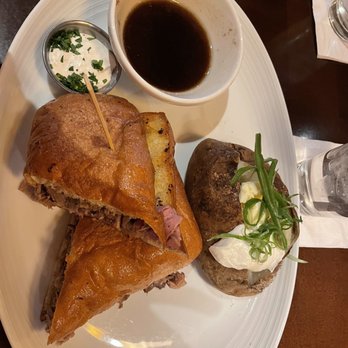 Stanford's - Prime Rib Dip Sandwich with baked potato - American Near Me - Seattle, Washington Stanford's - Prime Rib Dip Sandwich with baked potato - American Near Me - Seattle, Washington