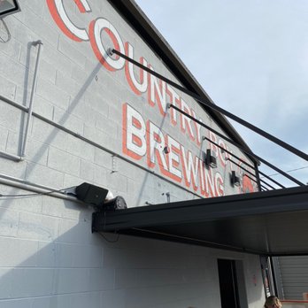 Country Boy Brewing - people sitting outside a building - Breweries Near Me - Lexington, Kentucky Country Boy Brewing - people sitting outside a building - Breweries Near Me - Lexington, Kentucky