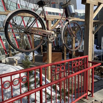 Cafe Bicyclette - a bicycle hanging from a wooden structure - French Near Me - Edmonton, Alberta Cafe Bicyclette - a bicycle hanging from a wooden structure - French Near Me - Edmonton, Alberta