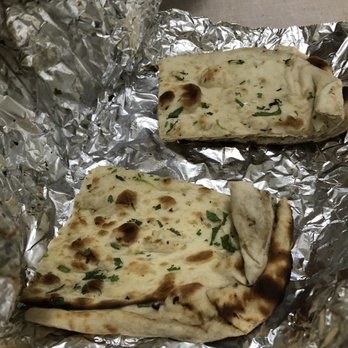 Amber India - Garlic and Basil Naan (one naan cut into four pieces for $5.75, rating: 3/5) - Indian Near Me - Los Altos, California Amber India - Garlic and Basil Naan (one naan cut into four pieces for $5.75, rating: 3/5) - Indian Near Me - Los Altos, California