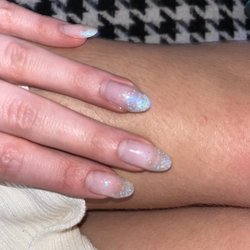 Pink Lotus Nails - Sparkly ombre nails, sparkles are pink blue green, rest of nail is natural!