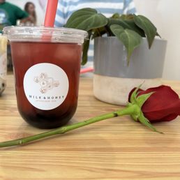 Hibiscus Sunrise loose leaf with house made strawberry sweetener and honey boba Hibiscus Sunrise loose leaf with house made strawberry sweetener and honey boba