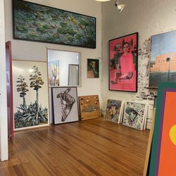 Commerce Gallery - Pieces of art in back.