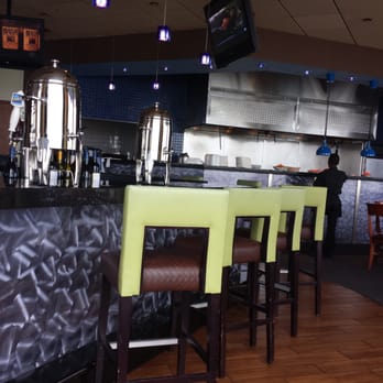Blue Water Grille - a bar with chairs and a television - New American Near Me - Atlantic City, New Jersey Blue Water Grille - a bar with chairs and a television - New American Near Me - Atlantic City, New Jersey