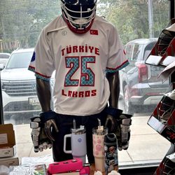 A fully dressed lacrosse player.