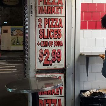$1 Pizza - a woman standing in front of a pizza oven - Pizza Near Me - New York, New York $1 Pizza - a woman standing in front of a pizza oven - Pizza Near Me - New York, New York