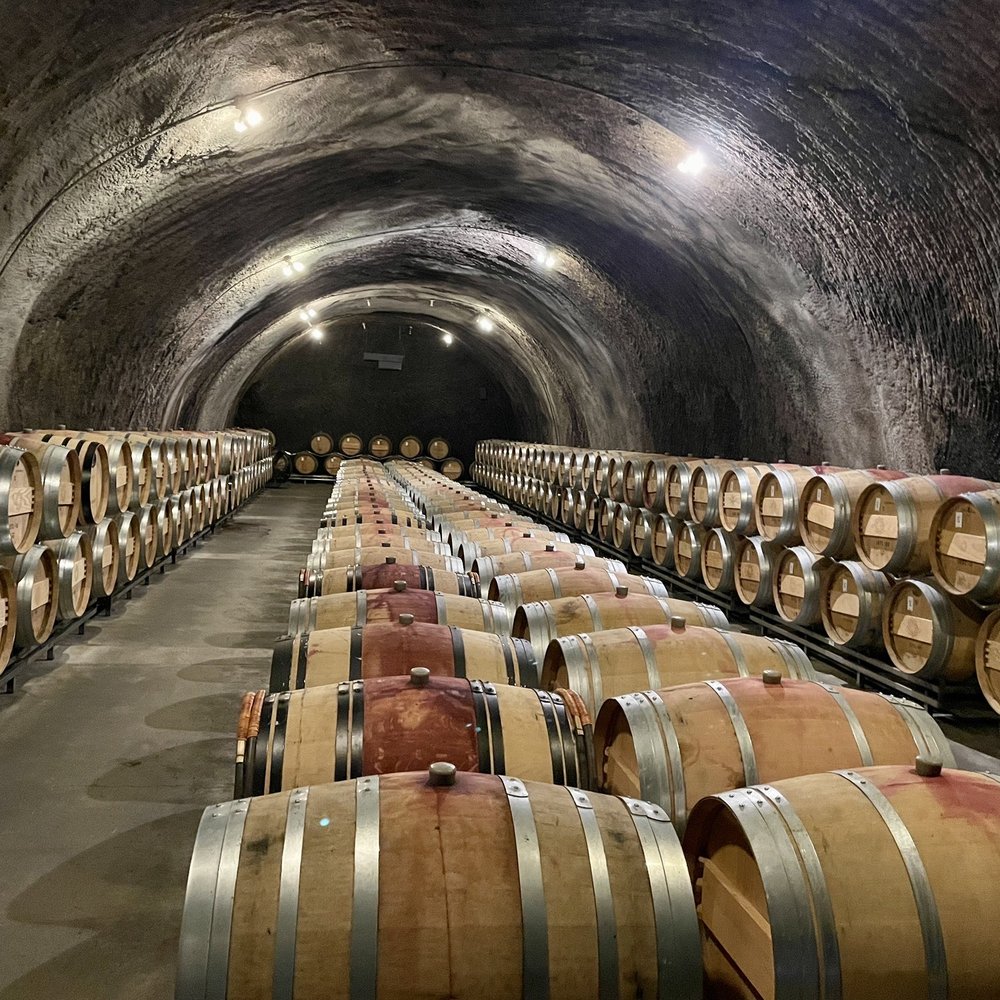 Repris Wines - rows of wine barrels in a wine cellar - Wineries Near Me - Sonoma, California Repris Wines - rows of wine barrels in a wine cellar - Wineries Near Me - Sonoma, California