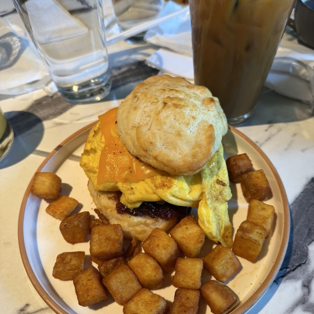 The Bird - Sausage, Egg, and Cheese with a side of home fries - Breakfast & Brunch Near Me - Norfolk, Virginia