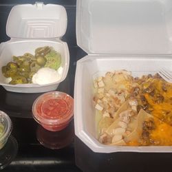 Fajitas nachos and guacamole scoop