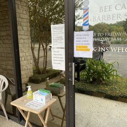 Bee Caves Barber Shop - Masks and hand sanitizer provided in front of entry.