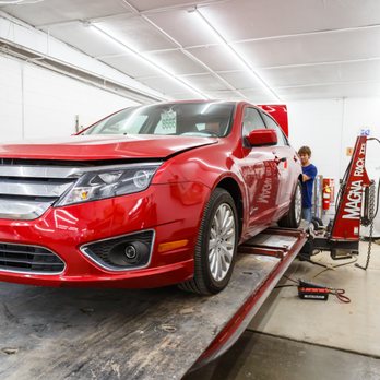 Quality Collision - Scott Eads on the Rack with a job and having fun doing it and very comfortable and confident in the equipment he using - Body Shops Near Me - Bloomington, Indiana