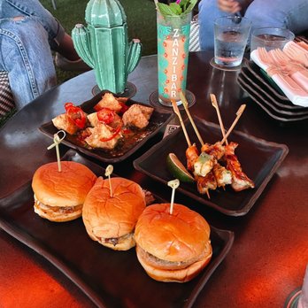 Zanzibar - Feels Like Summer Zanzibar Swizzle Pulled Pork Sliders Shrimp Skewers* BBQ Pork Wonton - Tiki Bars Near Me - Austin, Texas Zanzibar - Feels Like Summer Zanzibar Swizzle Pulled Pork Sliders Shrimp Skewers* BBQ Pork Wonton - Tiki Bars Near Me - Austin, Texas