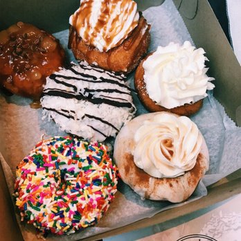 Doughology - Lynbrook - Clockwise: Apple Strudel, Churro, Cheescake (Berry flavored topping is available! Opted out.), French Toast, Confetti, Middle: Lemon Coconut - Donuts Near Me - Lynbrook, New York Doughology - Lynbrook - Clockwise: Apple Strudel, Churro, Cheescake (Berry flavored topping is available! Opted out.), French Toast, Confetti, Middle: Lemon Coconut - Donuts Near Me - Lynbrook, New York