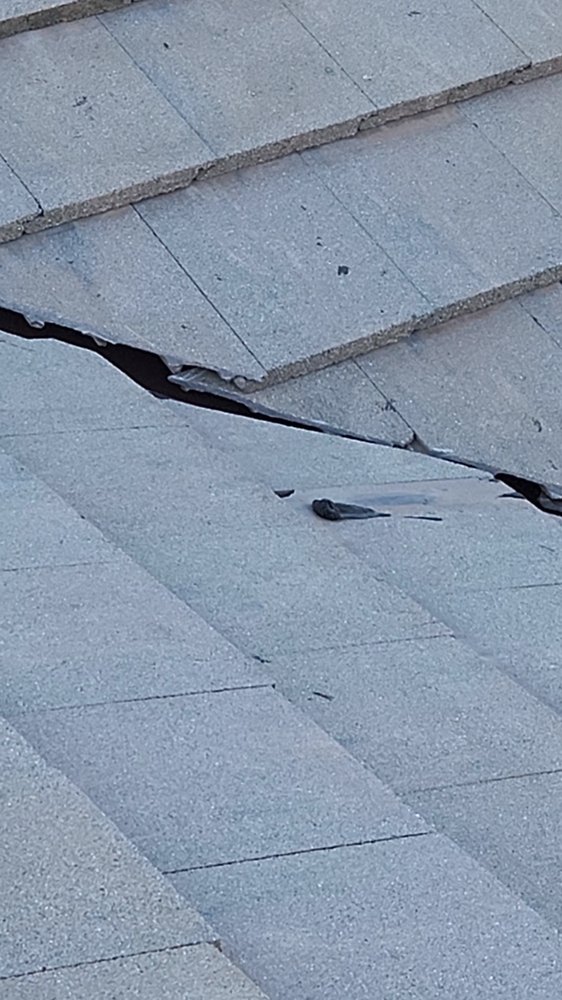 Slide of Rescue Roofing Construction