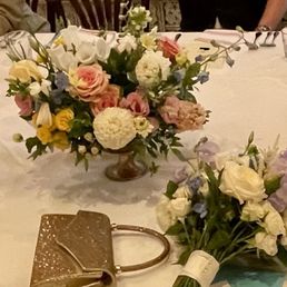 Our table arrangements and the bride's bouquet.