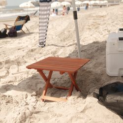 Perfect Beach Day NJ - Solid wood Cape Cod Beach Chair Co. side table set in the sand beside the cooler. Small touches included in every beach setup