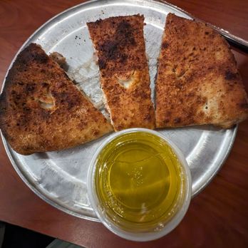 Fireside Pizza - Calzone with chicken, fresh mushrooms and red onions.  I chose the garlic garlic oil for my sauce.  Yum! - Pizza Near Me - Cincinnati, Ohio