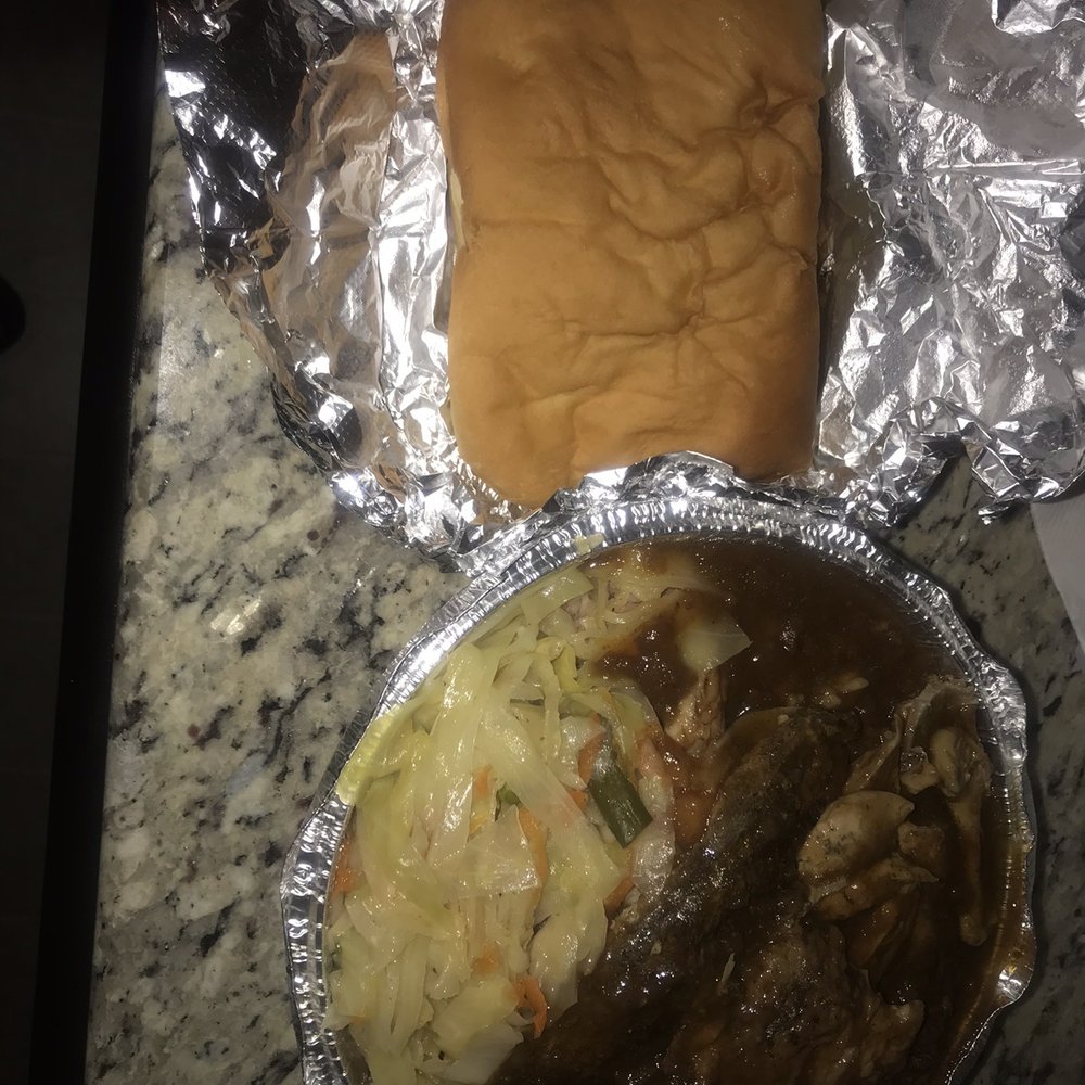Jerk Chicken with rice and peas, cabbage, and coco bread! Not the best photo, she was hungry after her work shift! Jerk Chicken with rice and peas, cabbage, and coco bread! Not the best photo, she was hungry after her work shift!
