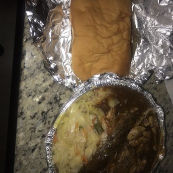 Jamaican Taste - Jerk Chicken with rice and peas, cabbage, and coco bread! Not the best photo, she was hungry after her work shift! - Caribbean Near Me - Richmond, Virginia Jamaican Taste - Jerk Chicken with rice and peas, cabbage, and coco bread! Not the best photo, she was hungry after her work shift! - Caribbean Near Me - Richmond, Virginia