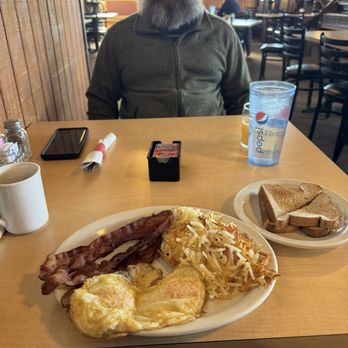 Cactus Jacks - a man sitting at a table with breakfast - American Near Me - Rawlins, Wyoming Cactus Jacks - a man sitting at a table with breakfast - American Near Me - Rawlins, Wyoming