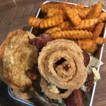 Outcast Bar And Grill - Black and Blue burger with Cajun fries! - Bars Near Me - Santa Rosa Beach, Florida