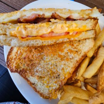 Florida Cracker Kitchen - Grilled cheese club.   A delicious Parmesan crusted 3 cheese, 3 layer grilled cheese with bacon & tomato - Southern Near Me - Brooksville, Florida