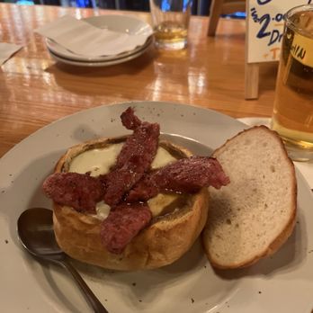 The Old Polish Corner - French onion soup bread bowl with added smoked sausage. . . - Bars Near Me - Alpena, Michigan