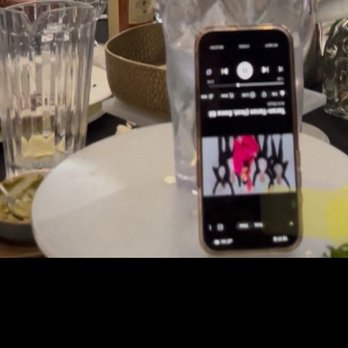 Veranda Restaurant - Cell phone on table playing music for our party. - Mediterranean Near Me - Glendale, California