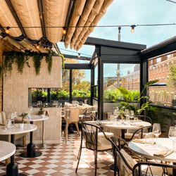 Upstairs At The Grill - Our beautiful outside terrace which has a retractable roof for those sunny days in the city!