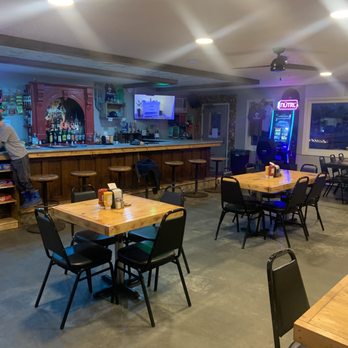 Hondo’s Hideaway - a restaurant with tables and chairs - Burgers Near Me - Jamestown, North Dakota