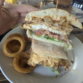 Saddles N Spurs Bar & Grill - Chicken sandwich fried with onion rings. I put a couple onion rings in the sandwich. - Chicken Wings Near Me - Abilene, Kansas Saddles N Spurs Bar & Grill - Chicken sandwich fried with onion rings. I put a couple onion rings in the sandwich. - Chicken Wings Near Me - Abilene, Kansas