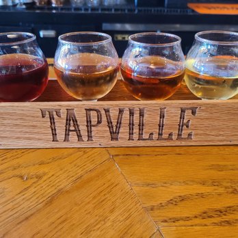 Tapville Social - Naperville - Cider Sampler range .59 to .79 an ounce - Bars Near Me - Naperville, Illinois Tapville Social - Naperville - Cider Sampler range .59 to .79 an ounce - Bars Near Me - Naperville, Illinois