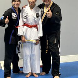 Final Strike Martial Arts - Master bates and miss Rantar  and my daughter Brianna getting her new lever belt could not be more excited for her .